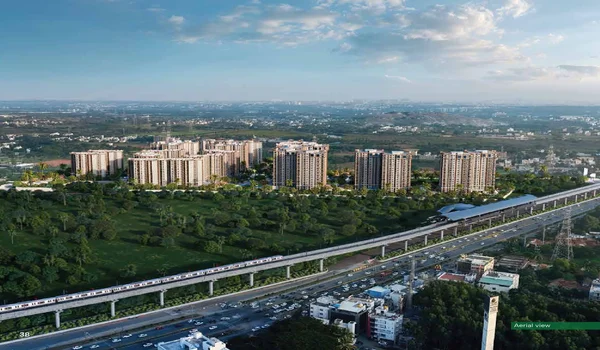 A wide aerial architectural rendering of Sattva City, a large-scale apartment project in Meenakunte Hosur, North Bangalore. The image shows several modern high-rise residential towers set against a backdrop of lush green fields and forests. In the foreground, a prominent elevated metro rail line with a passing train and a metro station sits parallel to a busy multi-lane highway, emphasizing the project's transit-oriented development.