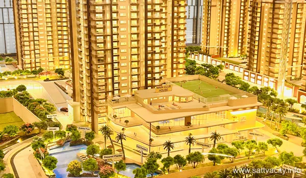 A focused shot of the miniature pool area within the Sattva City project model, showing a 'Pool Pavilion,' 'Jacuzzi,' and 'Kids Pool' nestled at the base of illuminated residential skyscrapers.